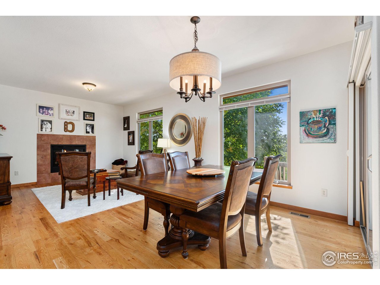 6747 Spanish Bay Drive Windsor, CO 80550 - Photo 12 of 30 a view of a dining room with furniture window and wooden floor