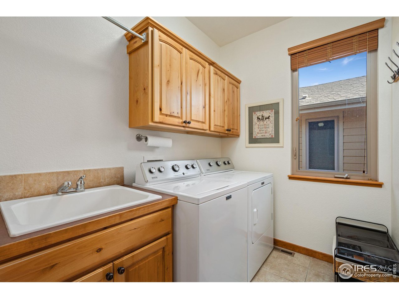 6747 Spanish Bay Drive Windsor, CO 80550 - Photo 14 of 30 a utility room with dryer and washer