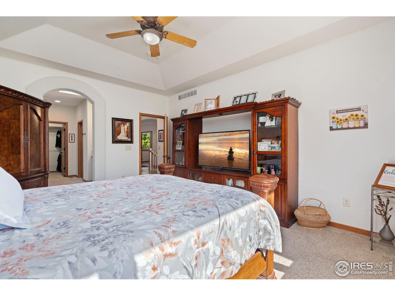 6747 Spanish Bay Drive Windsor, CO 80550 - Photo 16 of 30 a bedroom with a bed and a dresser