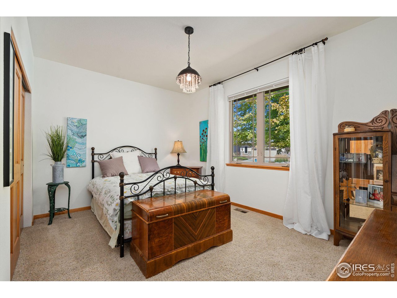 6747 Spanish Bay Drive Windsor, CO 80550 - Photo 19 of 30 a living room with furniture and a window