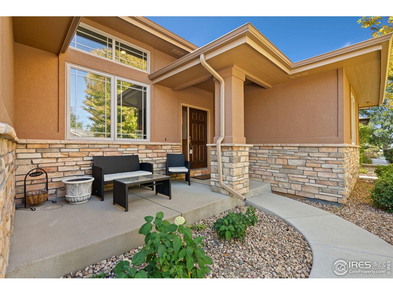 6747 Spanish Bay Drive Windsor, CO 80550 - Photo 2 of 30 a living room with furniture and a window