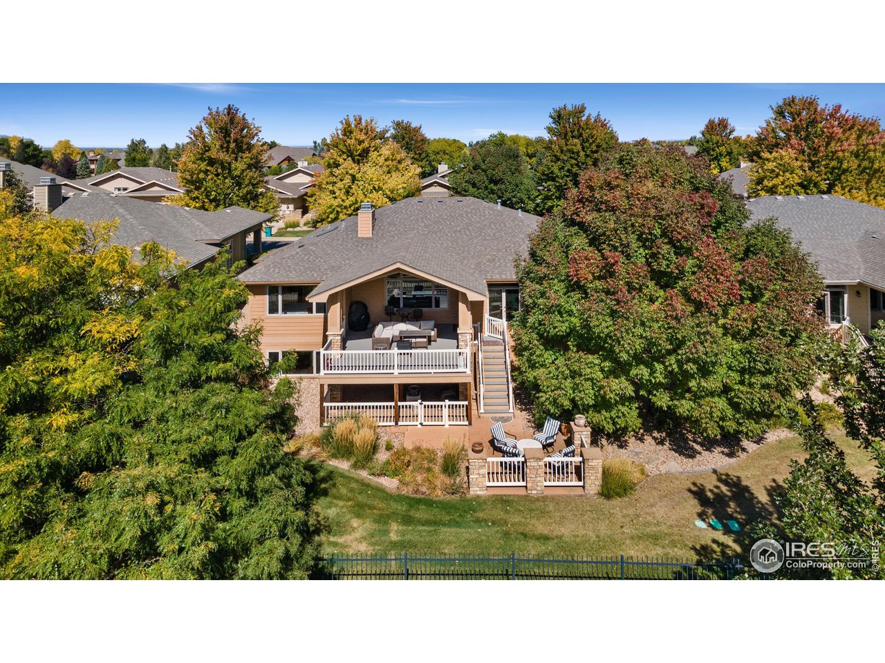 6747 Spanish Bay Drive Windsor, CO 80550 - Photo 28 of 30 a aerial view of a house with a garden