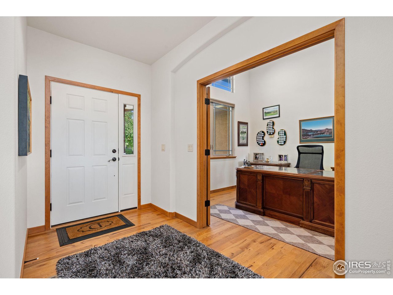 6747 Spanish Bay Drive Windsor, CO 80550 - Photo 5 of 30 a bedroom with a bed and a dresser