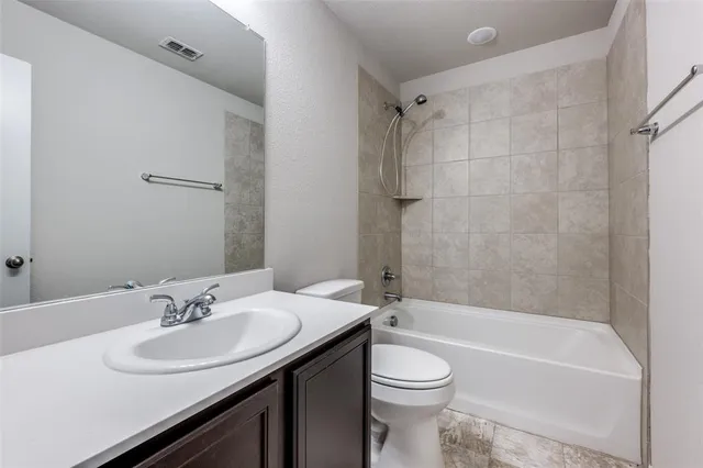 a bathroom with a sink a toilet and a bathtub