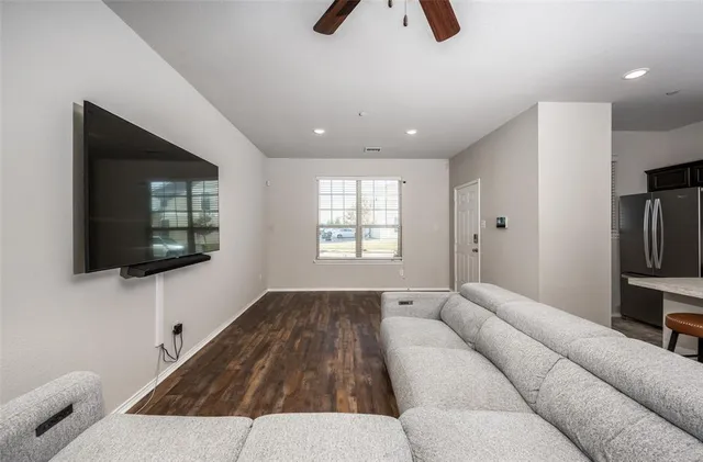 a living room with a couch and a flat screen tv