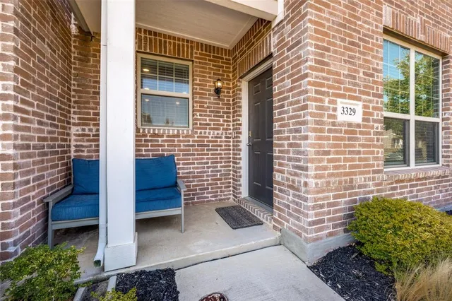 a view of front door of house with stairs
