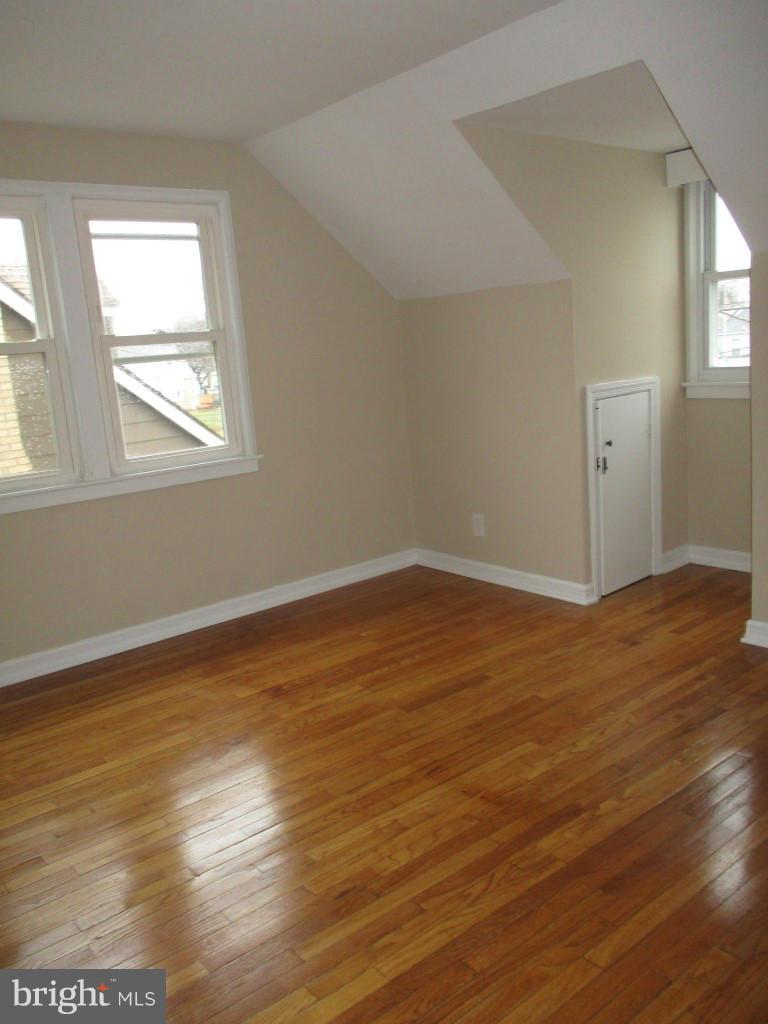 8200 Northview Road Baltimore, MD 21222 - Photo 11 of 14 a view of an empty room with wooden floor and a window
