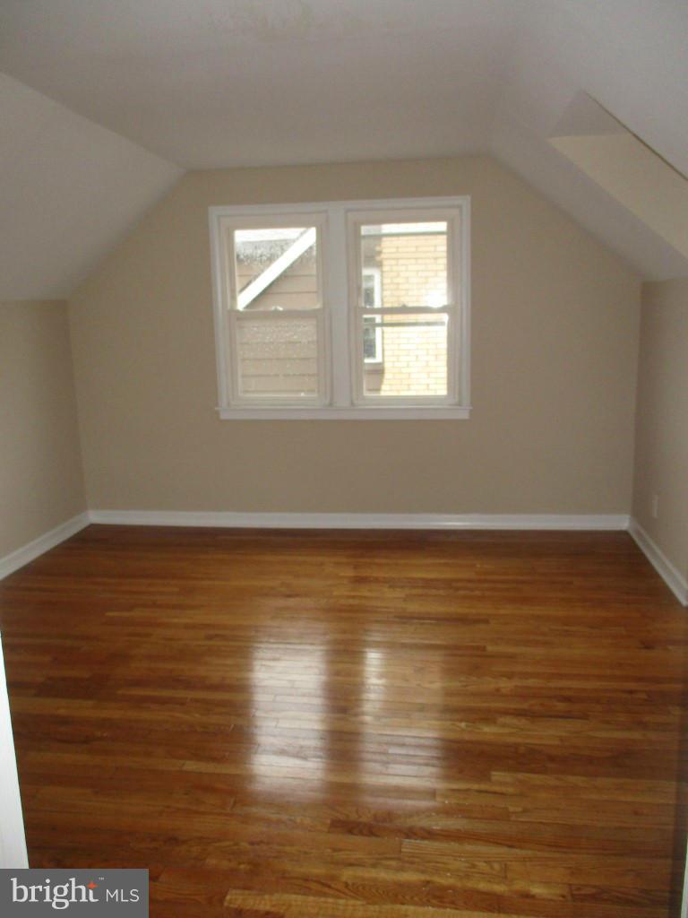 8200 Northview Road Baltimore, MD 21222 - Photo 10 of 14 wooden floor in an empty room with a window