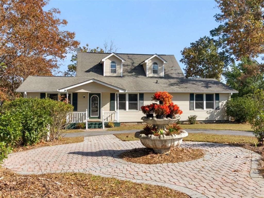 296 Reeves Road Jackson, GA 30233 - Photo 2 of 78 a front view of a house with a yard and a fountain