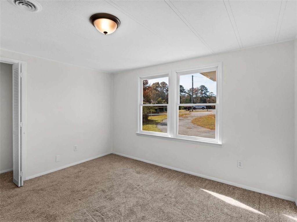 296 Reeves Road Jackson, GA 30233 - Photo 23 of 78 an empty room with windows