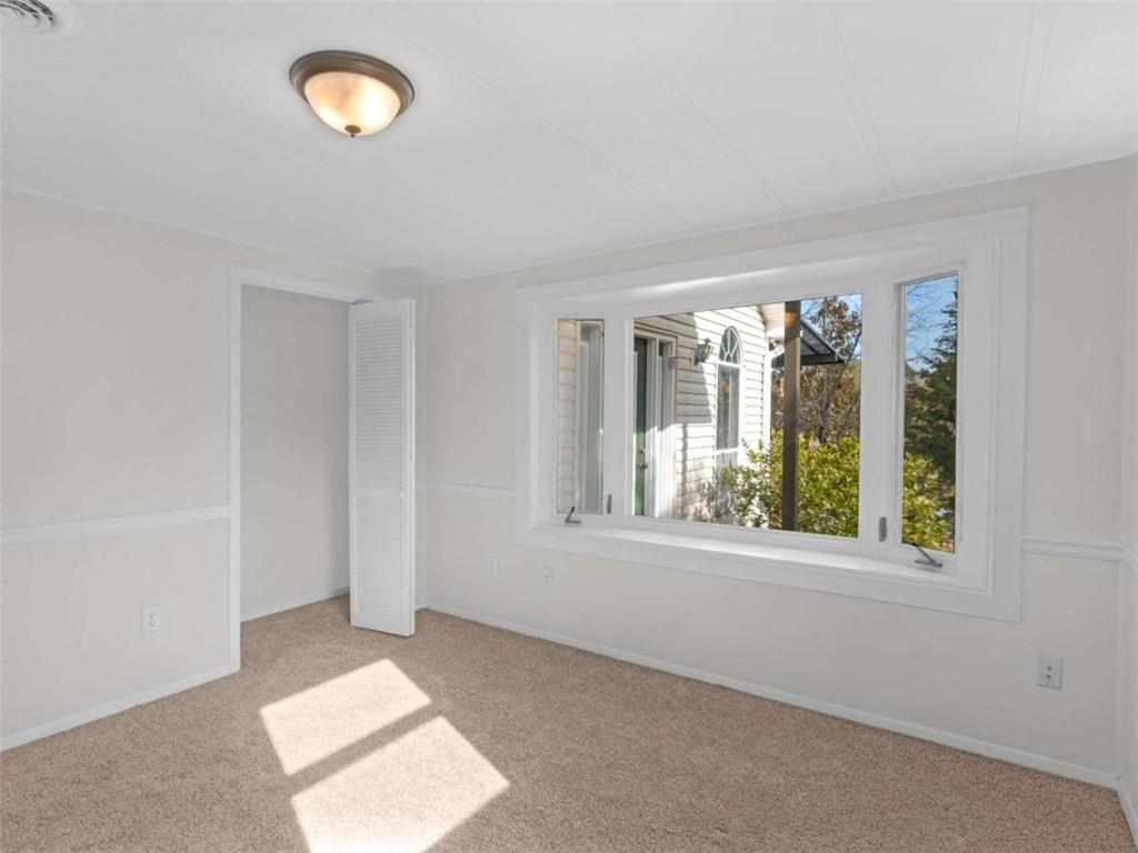 296 Reeves Road Jackson, GA 30233 - Photo 27 of 78 an empty room with windows