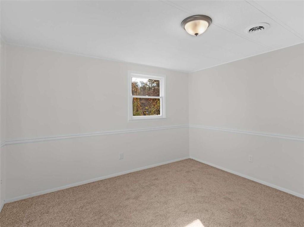 296 Reeves Road Jackson, GA 30233 - Photo 29 of 78 an empty room with a window