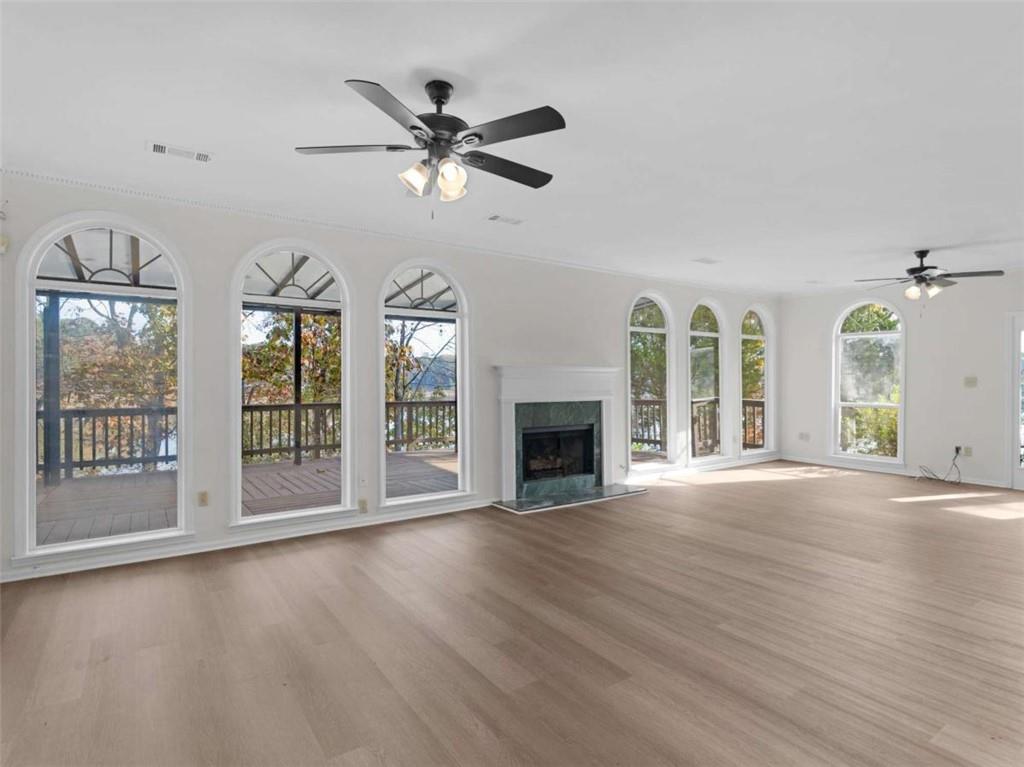 296 Reeves Road Jackson, GA 30233 - Photo 3 of 78 a view of an empty room with wooden floor and a window