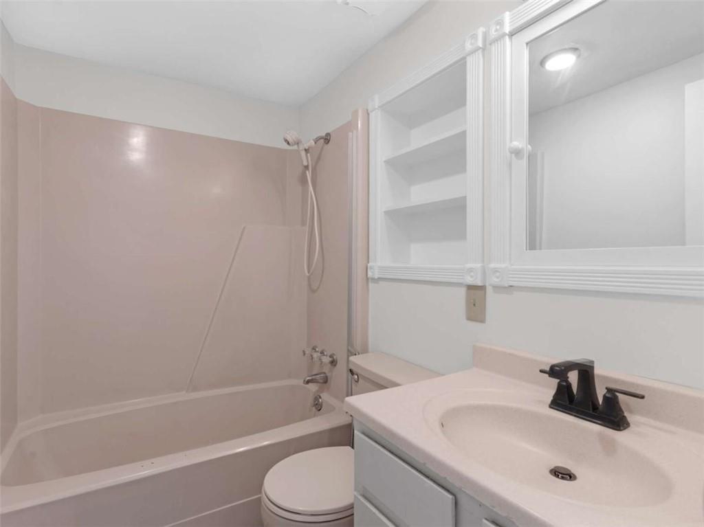 296 Reeves Road Jackson, GA 30233 - Photo 34 of 78 a bathroom with a sink toilet and shower