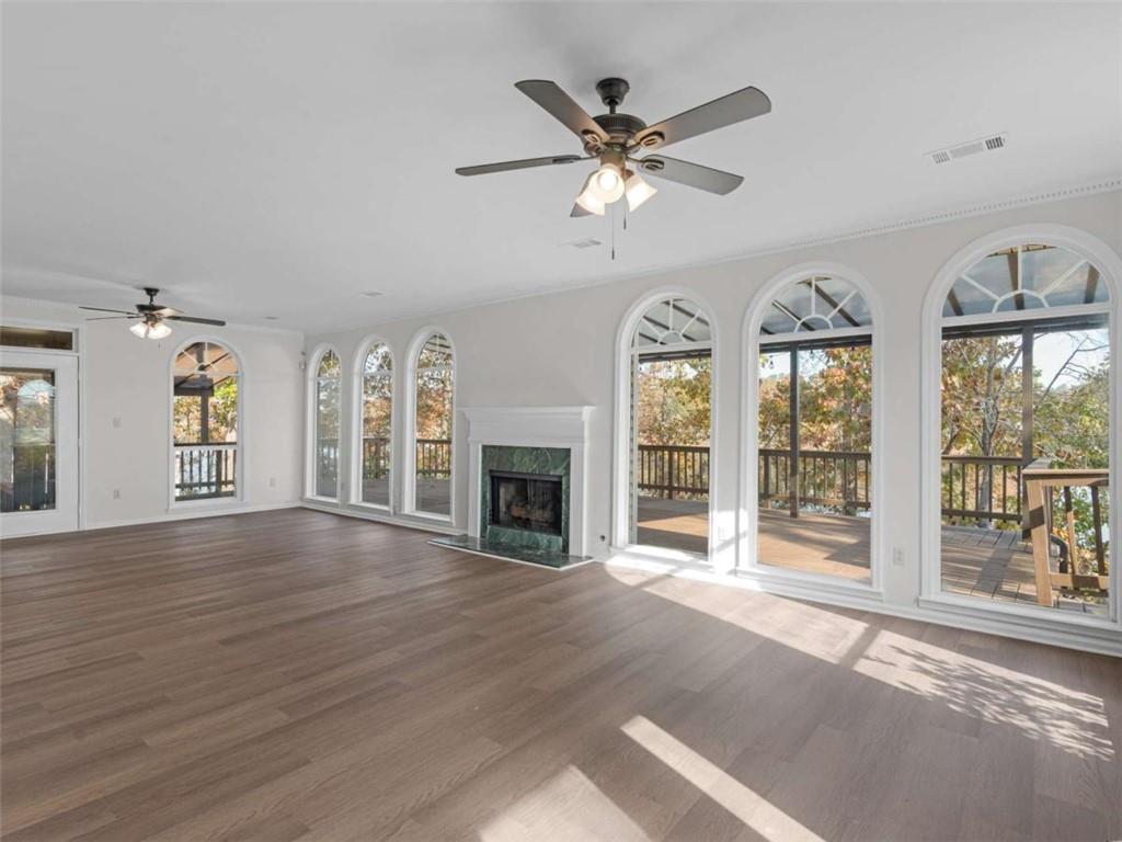 296 Reeves Road Jackson, GA 30233 - Photo 4 of 78 a view of an empty room with wooden floor and a window