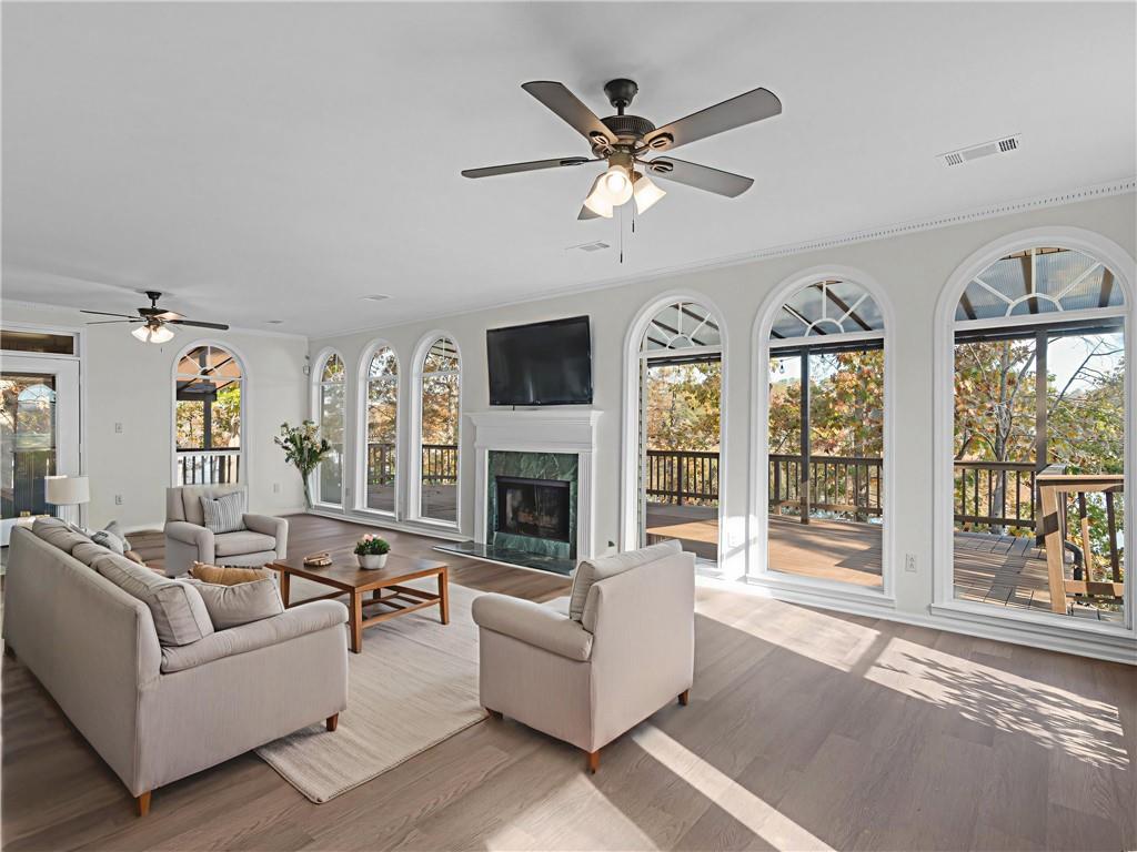 296 Reeves Road Jackson, GA 30233 - Photo 5 of 78 a living room with furniture large window and fireplace