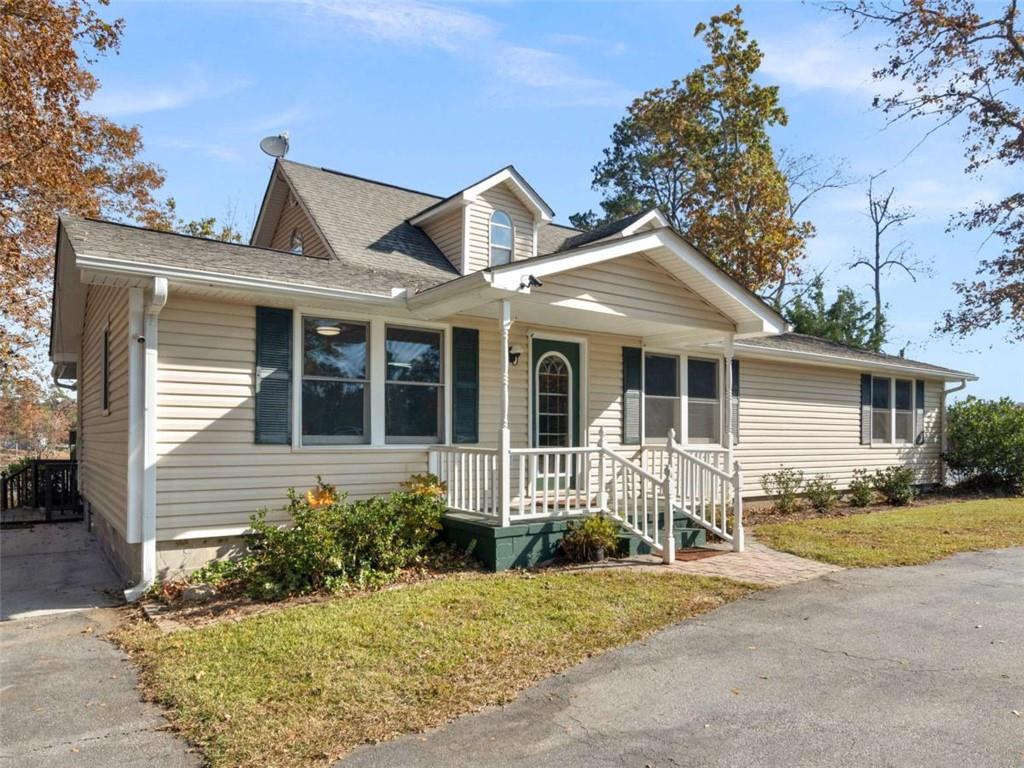 296 Reeves Road Jackson, GA 30233 - Photo 78 of 78 a front view of a house with a garden