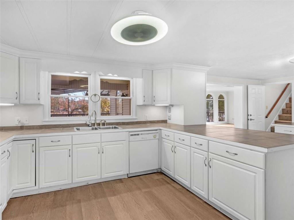 296 Reeves Road Jackson, GA 30233 - Photo 9 of 78 a spacious bathroom with a double vanity sink and a window