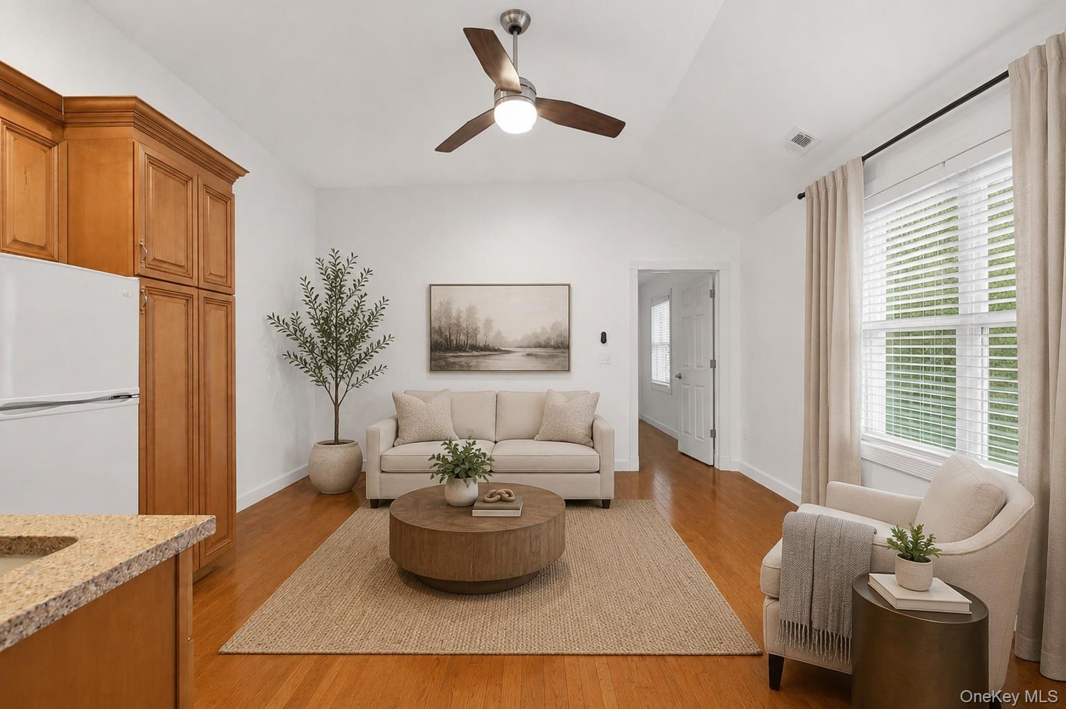 12 Leeside Road Carmel, NY 10512 - Photo 20 of 44 Open concept bonus room area featuring kitchenette wood-finish flooring, a vaulted ceiling, and a ceiling fan