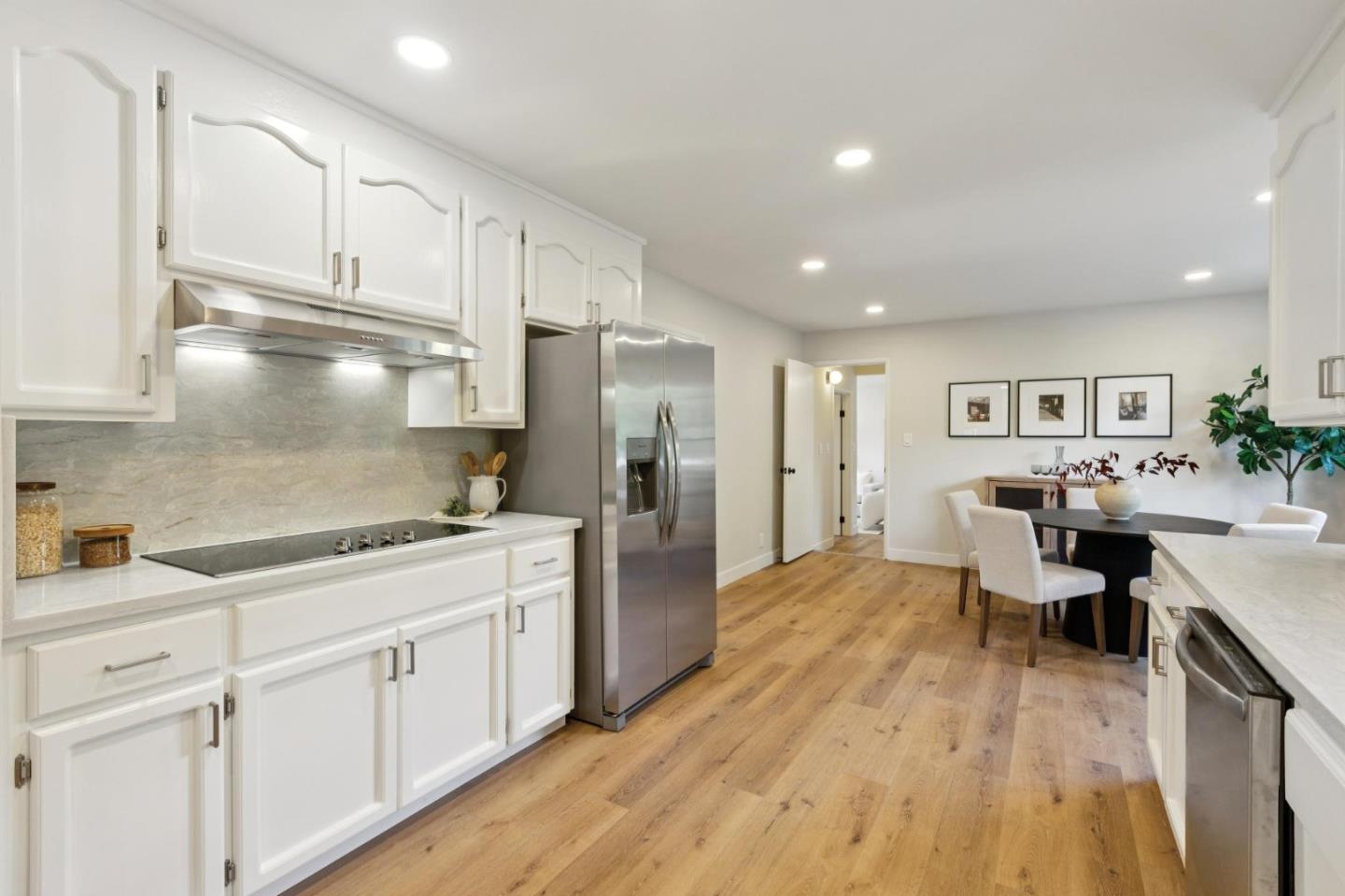755 Santa Rita Avenue Los Altos, CA 94022 - Photo 18 of 50 a kitchen with white cabinets and appliances