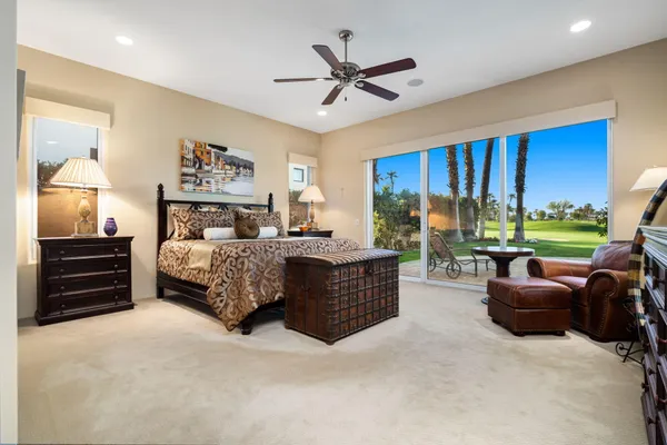 a bedroom with a bed and a couch