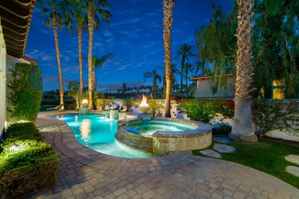 a view of a swimming pool with a patio