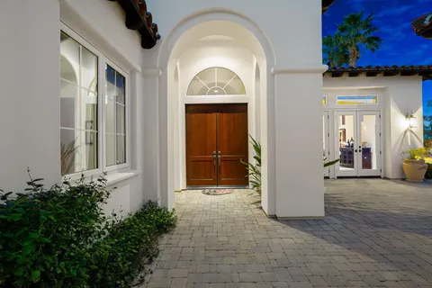 a view of a entryway door and garden