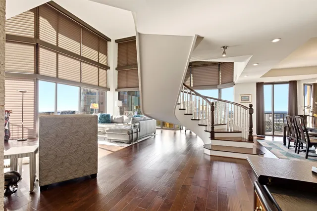 a balcony with furniture and wooden floor