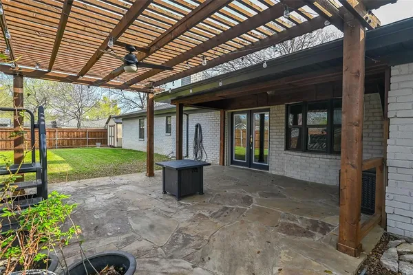 a view of a yard with a house and a garden