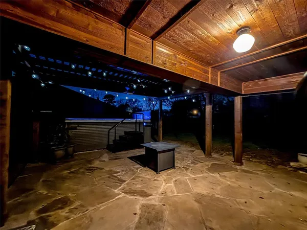 a view of a swimming pool with an outdoor seating