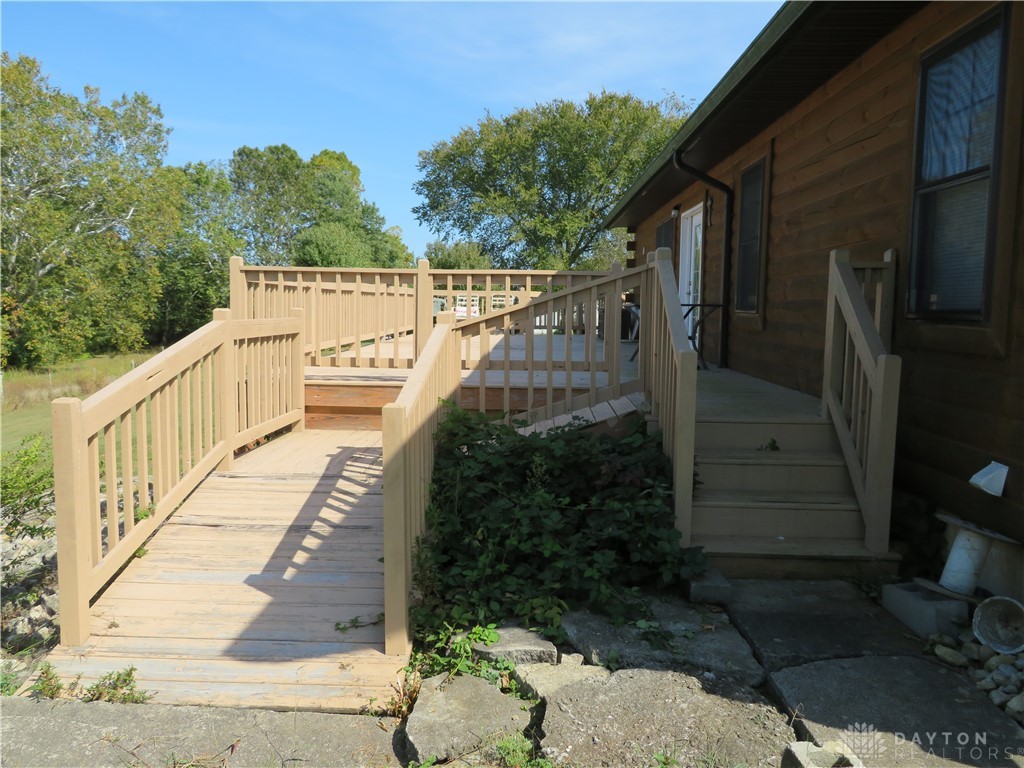 748 Inlow Avenue Peebles, OH 45660 - Photo 30 of 61 This charming home offers direct outdoor access with a ramp and steps leading to the entrance.