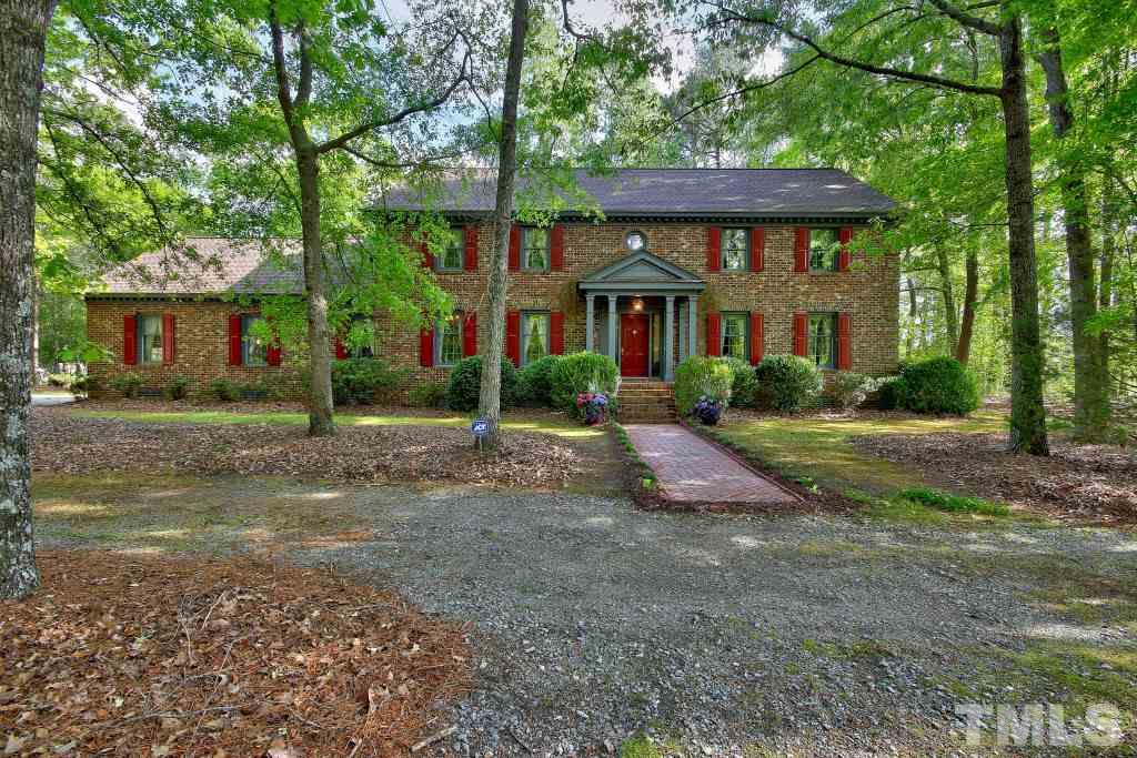 6257 Moore Road Red Oak, NC 27856 - Photo 1 of 25 a front view of a house with a yard