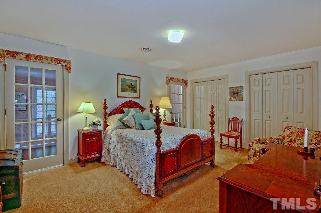 6257 Moore Road Red Oak, NC 27856 - Photo 16 of 25 a bed room with a bed and a window