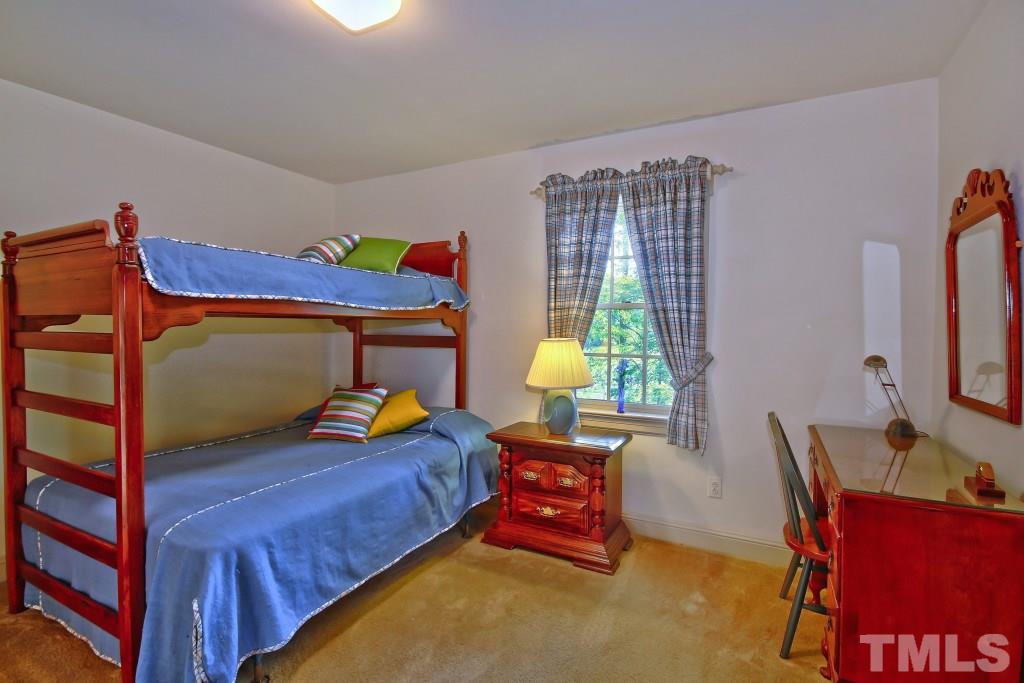 6257 Moore Road Red Oak, NC 27856 - Photo 17 of 25 a bedroom with a bed and a window