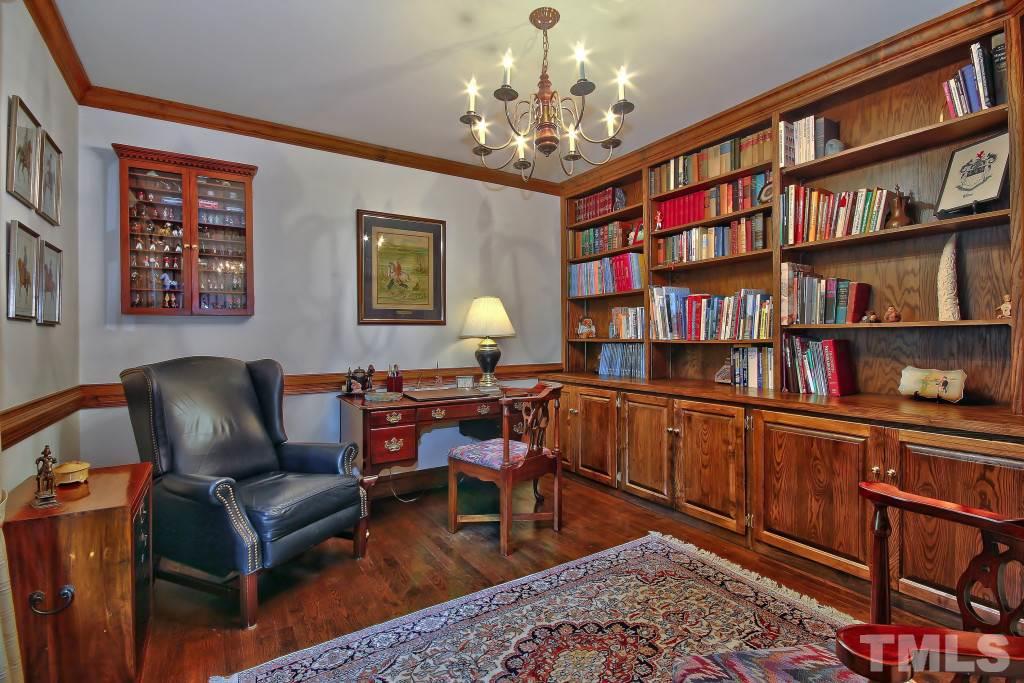 6257 Moore Road Red Oak, NC 27856 - Photo 3 of 25 a work room with furniture and book shelf