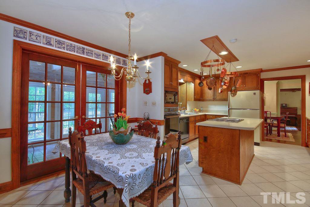 6257 Moore Road Red Oak, NC 27856 - Photo 6 of 25 a kitchen with a table and chairs in it