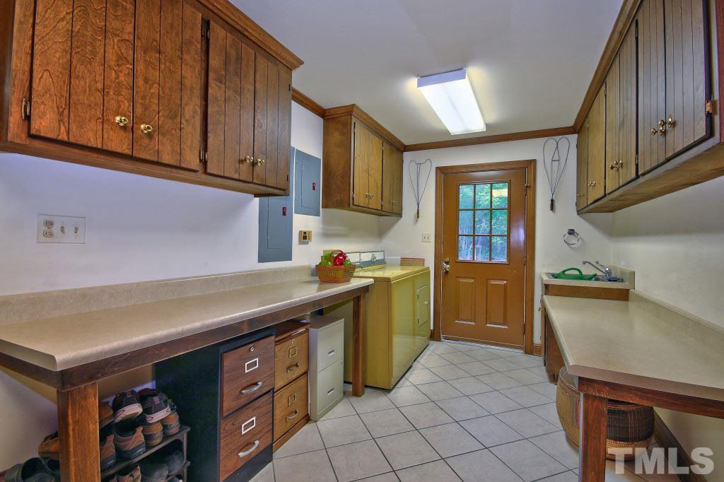 6257 Moore Road Red Oak, NC 27856 - Photo 8 of 25 a kitchen with stainless steel appliances granite countertop a sink and cabinets