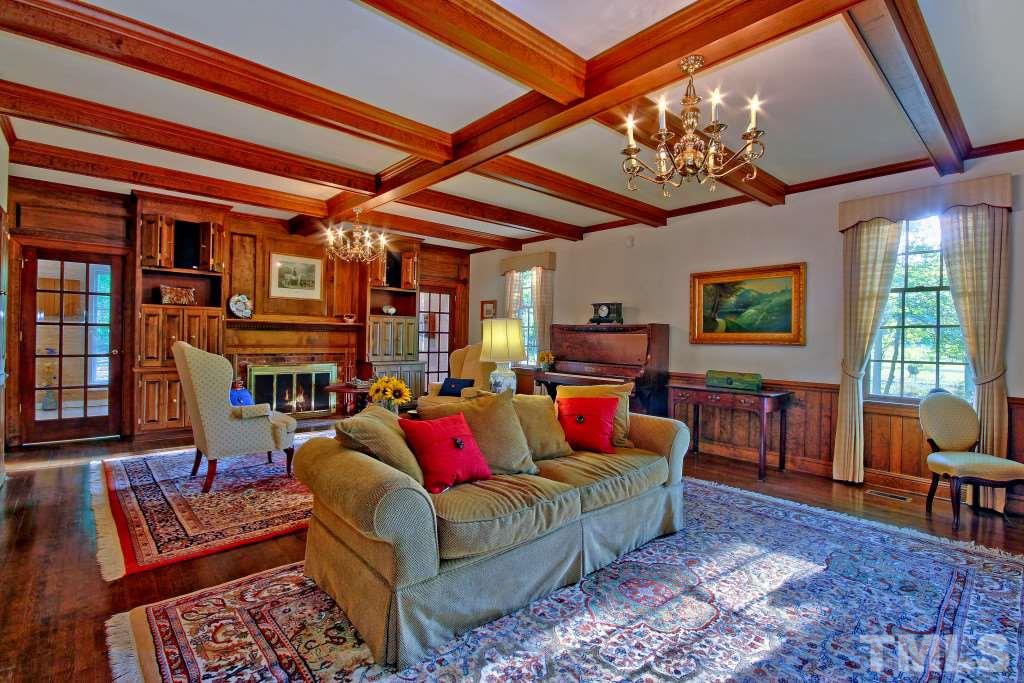 6257 Moore Road Red Oak, NC 27856 - Photo 9 of 25 a living room with fireplace furniture and a chandelier