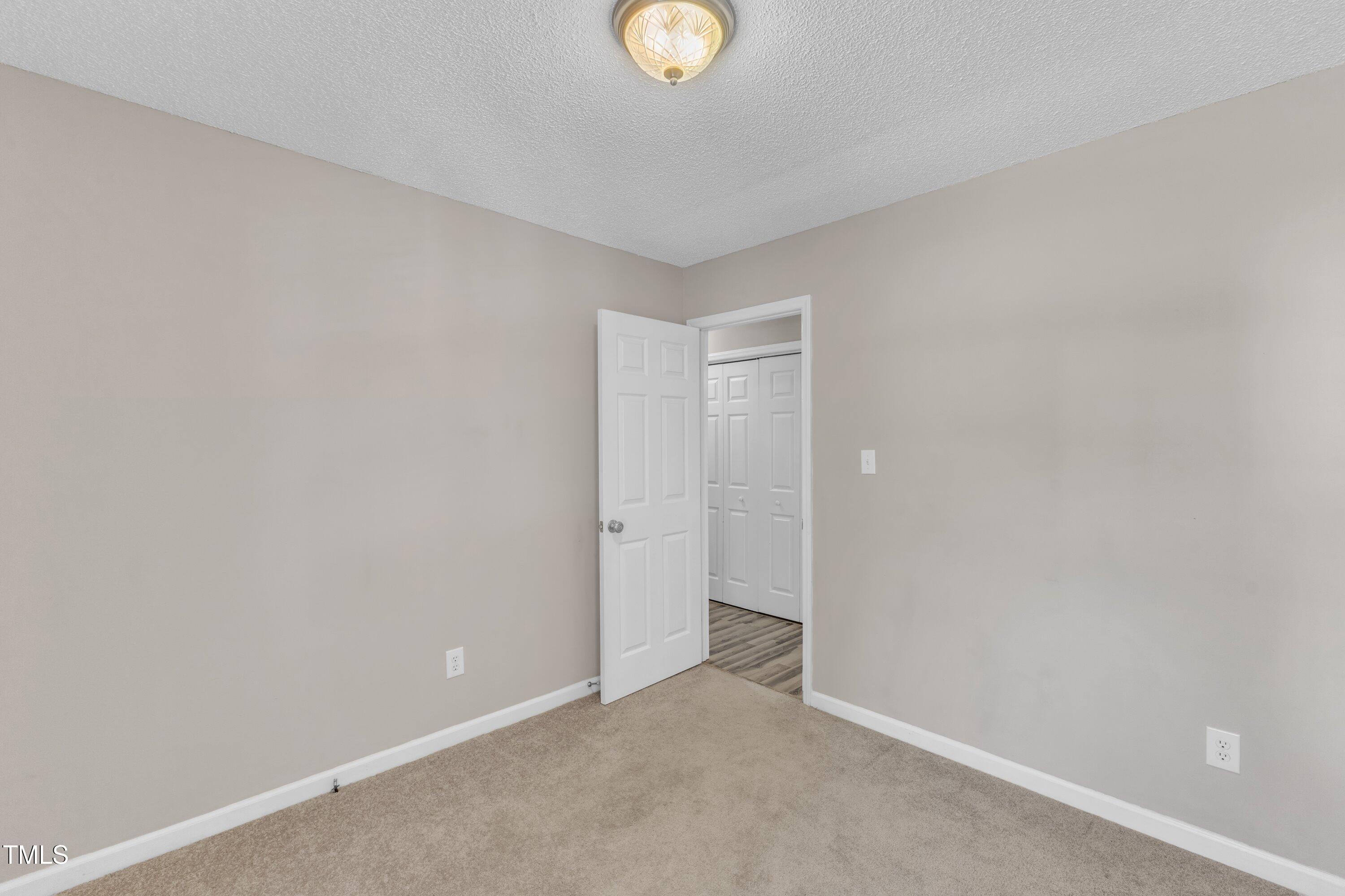 4533 Whistling Way Raleigh, NC 27616 - Photo 16 of 25 Lots of wall space in these bedrooms.