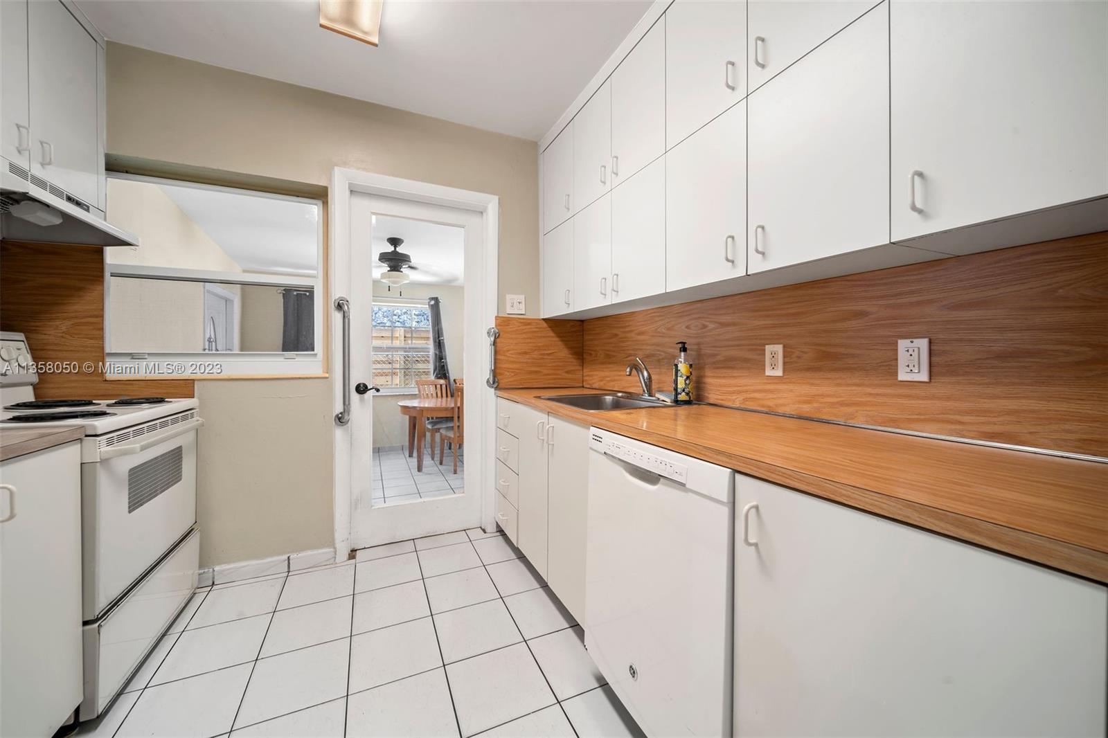 1911 Southwest 23rd Street Miami, FL 33145 - Photo 11 of 48 a kitchen with a sink and cabinets