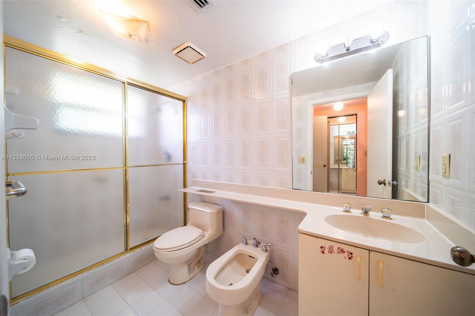 1911 Southwest 23rd Street Miami, FL 33145 - Photo 18 of 48 a bathroom with a toilet sink and shower