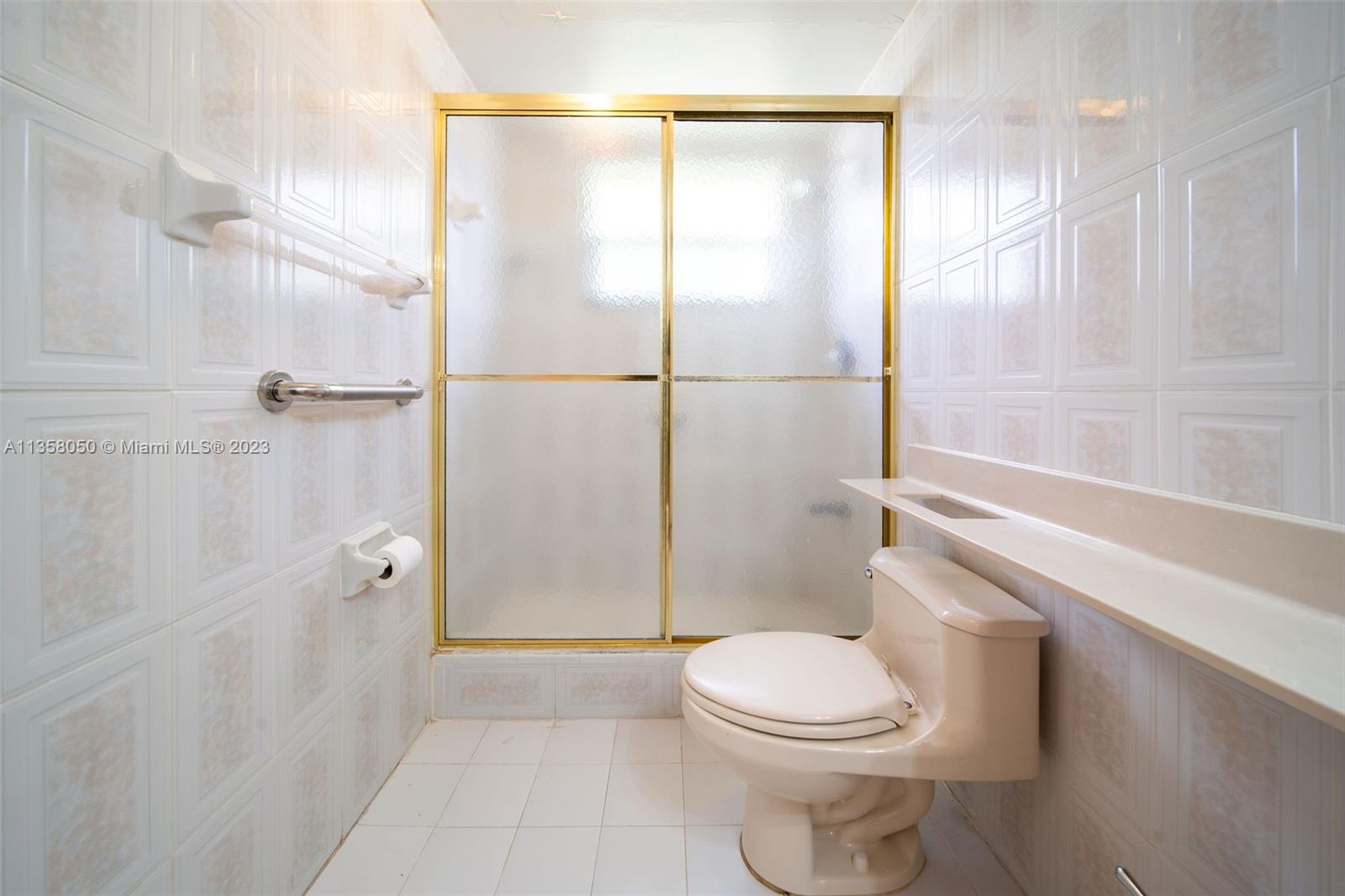 1911 Southwest 23rd Street Miami, FL 33145 - Photo 19 of 48 a bathroom with a toilet and a shower