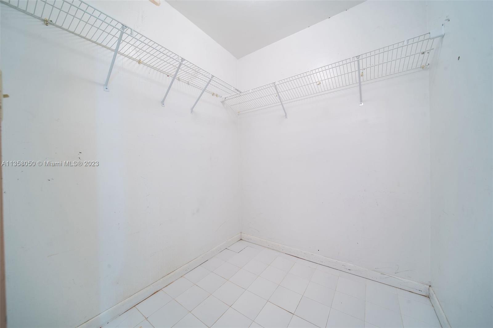 1911 Southwest 23rd Street Miami, FL 33145 - Photo 20 of 48 a view of a room with racks on the wall