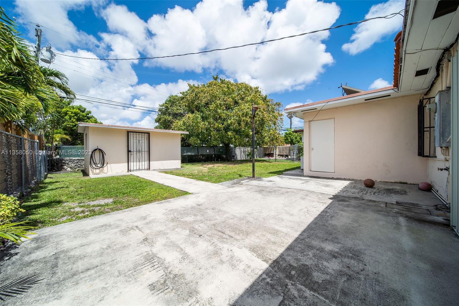 1911 Southwest 23rd Street Miami, FL 33145 - Photo 31 of 48 a view of a house with a yard and garage