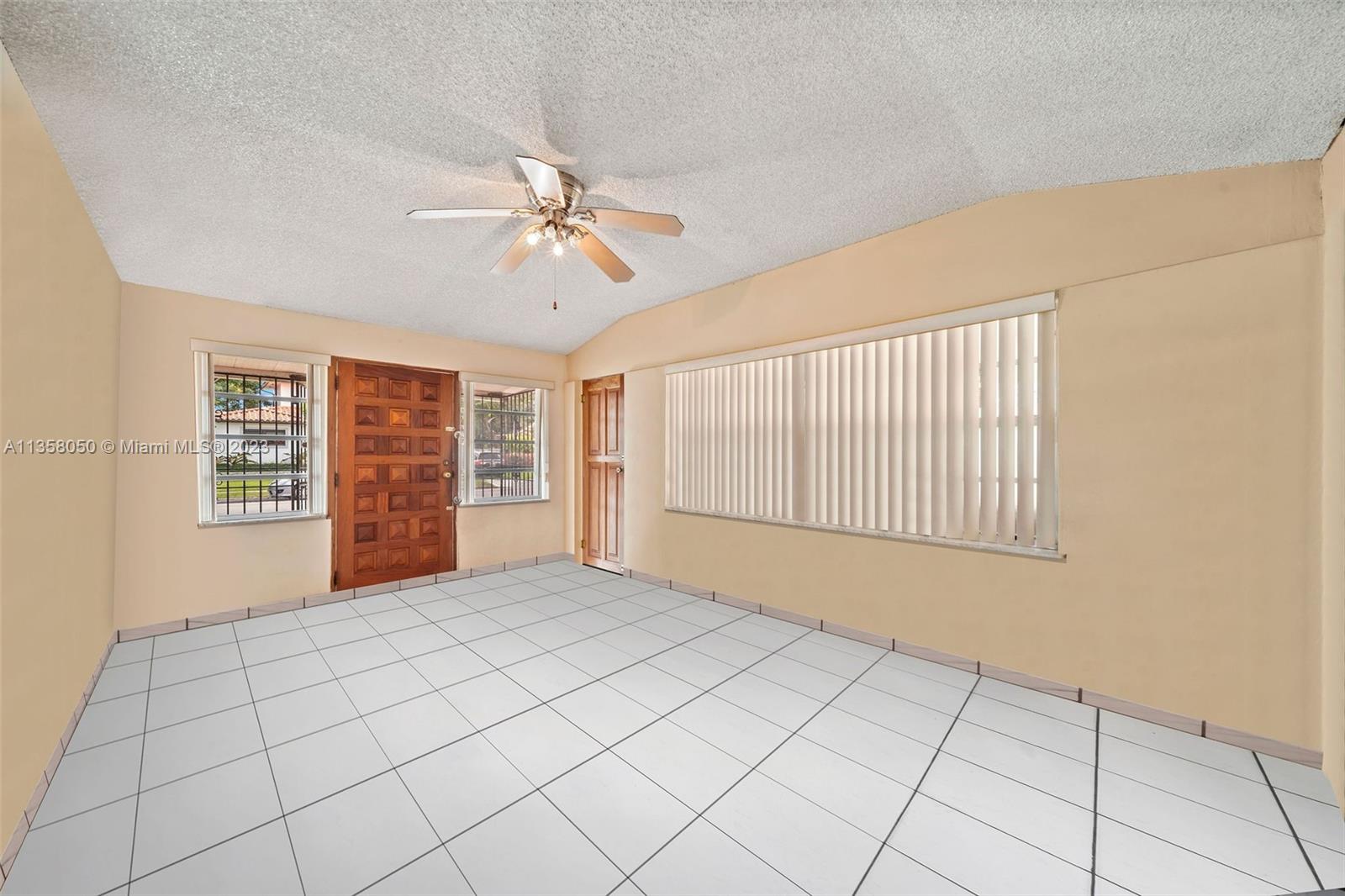 1911 Southwest 23rd Street Miami, FL 33145 - Photo 6 of 48 a view of an empty room with a window