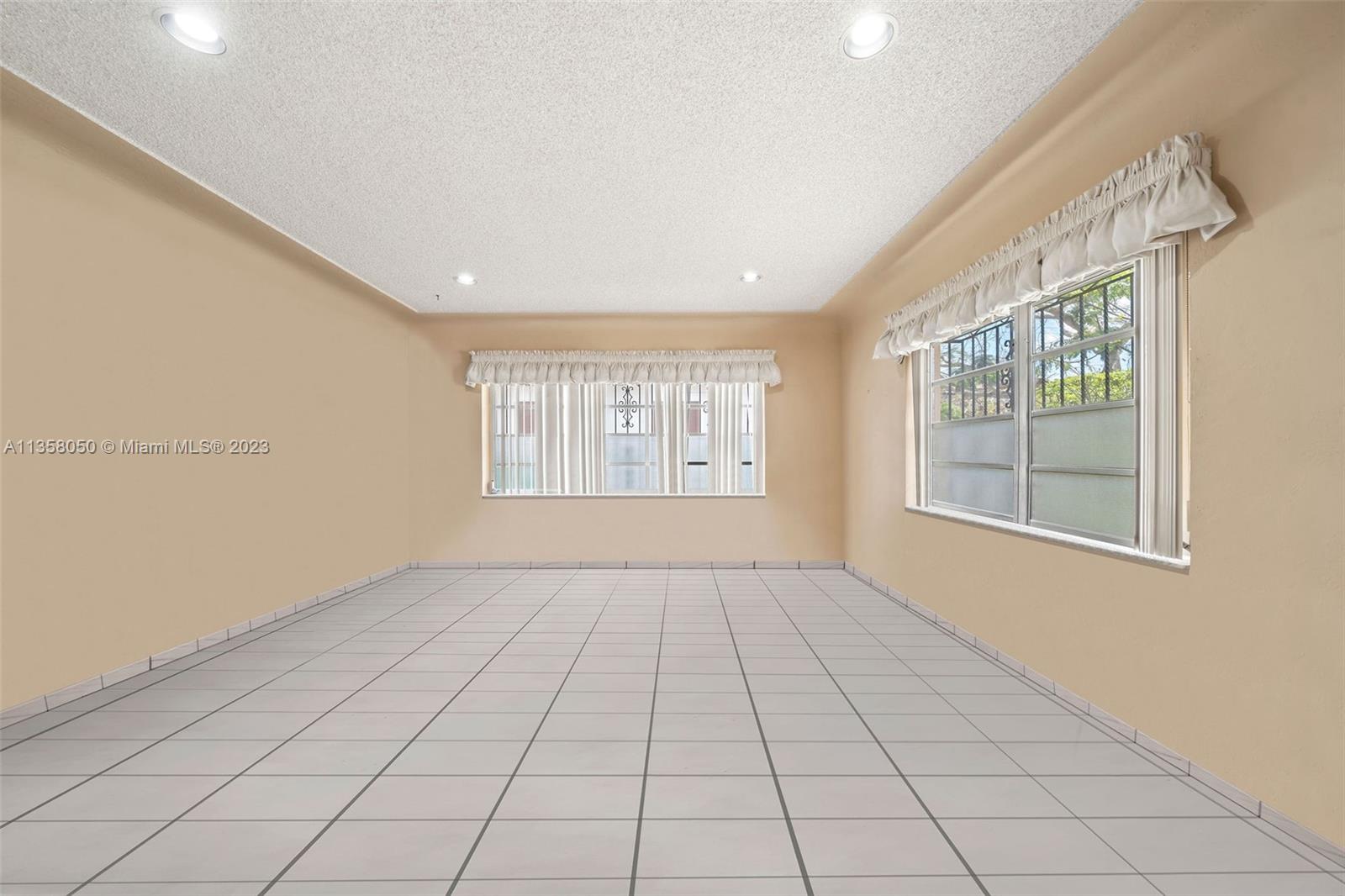 1911 Southwest 23rd Street Miami, FL 33145 - Photo 9 of 48 a view of an empty room with a window