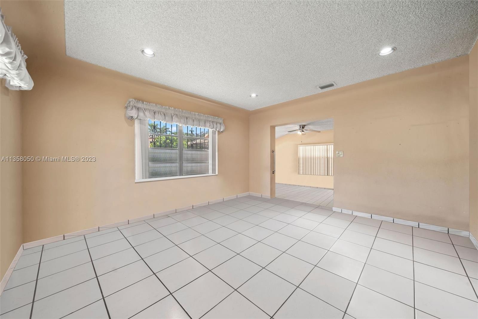 1911 Southwest 23rd Street Miami, FL 33145 - Photo 10 of 48 a view of an empty room and window
