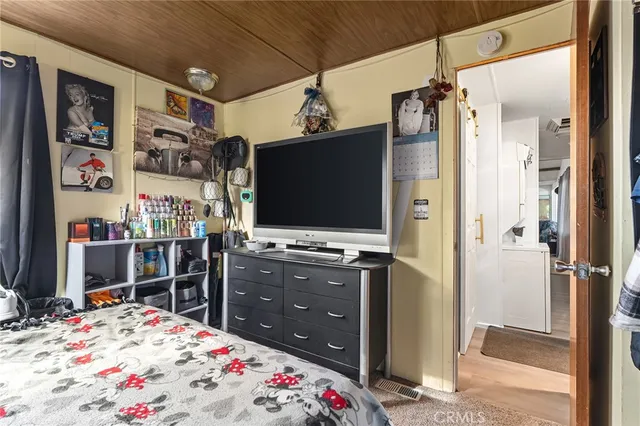 a bathroom with a granite countertop sink toilet a mirror and a shower