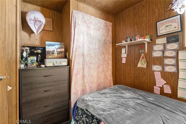 a view of a patio with a table chairs and backyard