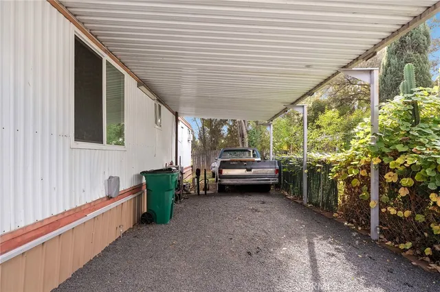 a view of a house with wooden fence